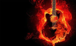 Guitar made of fire set against a black background