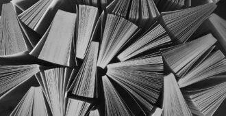 a bunch of books standing up, viewed from the top-down