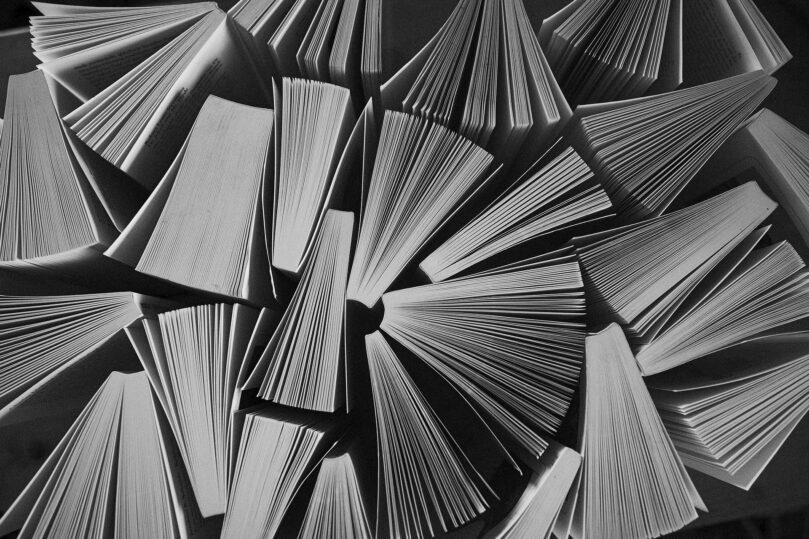 a bunch of books standing up, viewed from the top-down