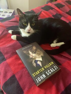 this cat is named kaz so its a cat criminal named after a criminal who sometimes does cat burglary. there's also a copy of starter villain by john scalzi