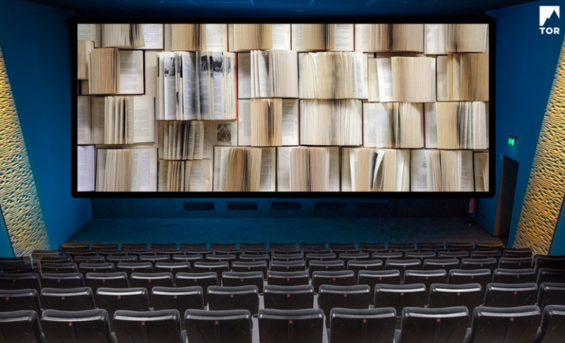 interior of a movie theater but the screen is just open pages of many books 63A